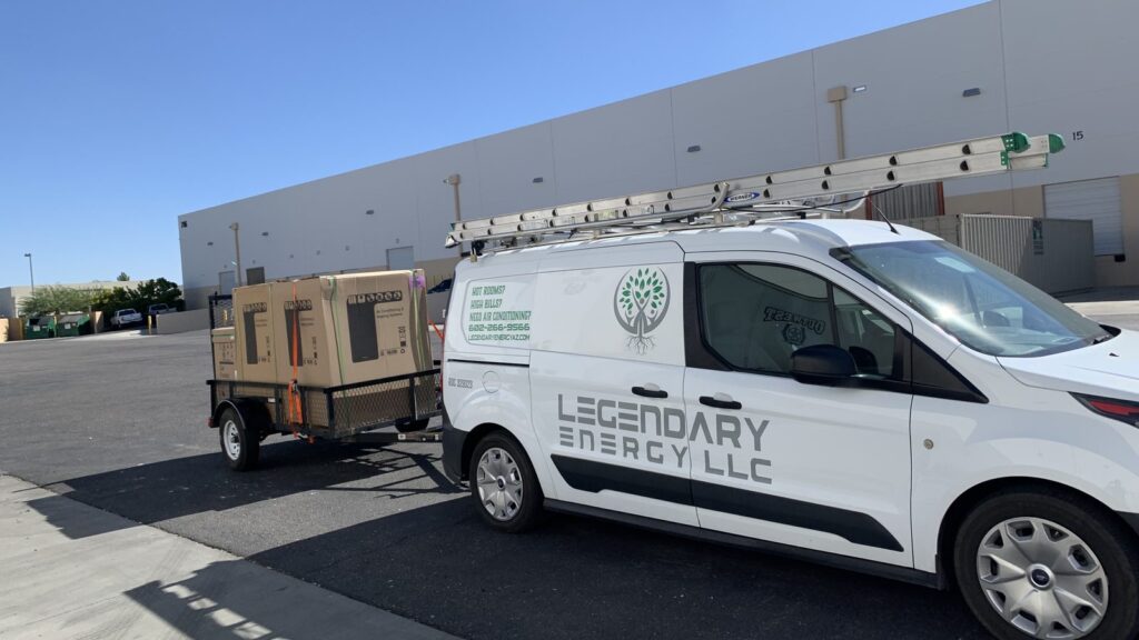 Legendary Energy service van and equipment trailer parked at a Phoenix commercial job
